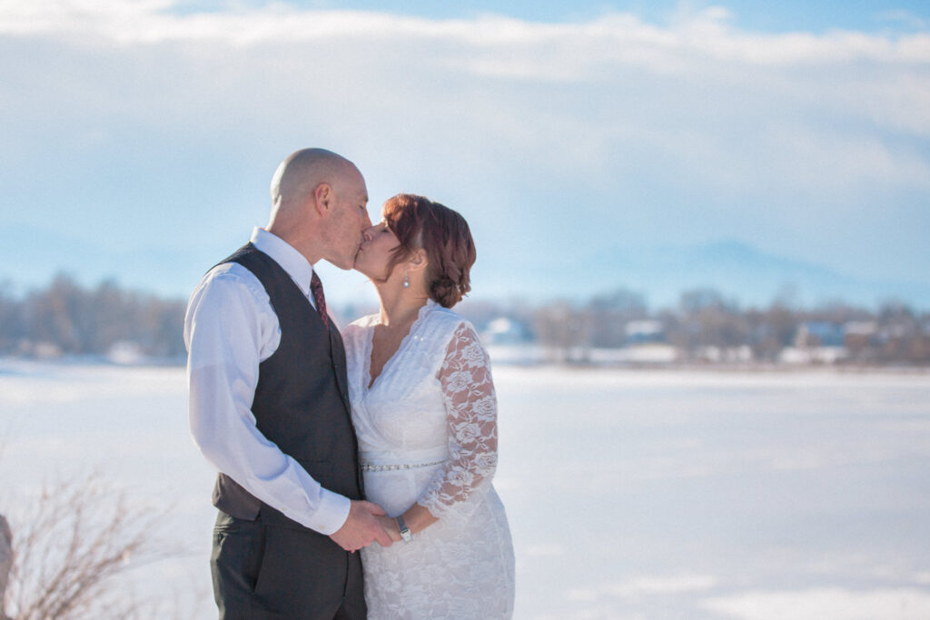 A couple kiss during their Colorado Elopement at Waneka Lake