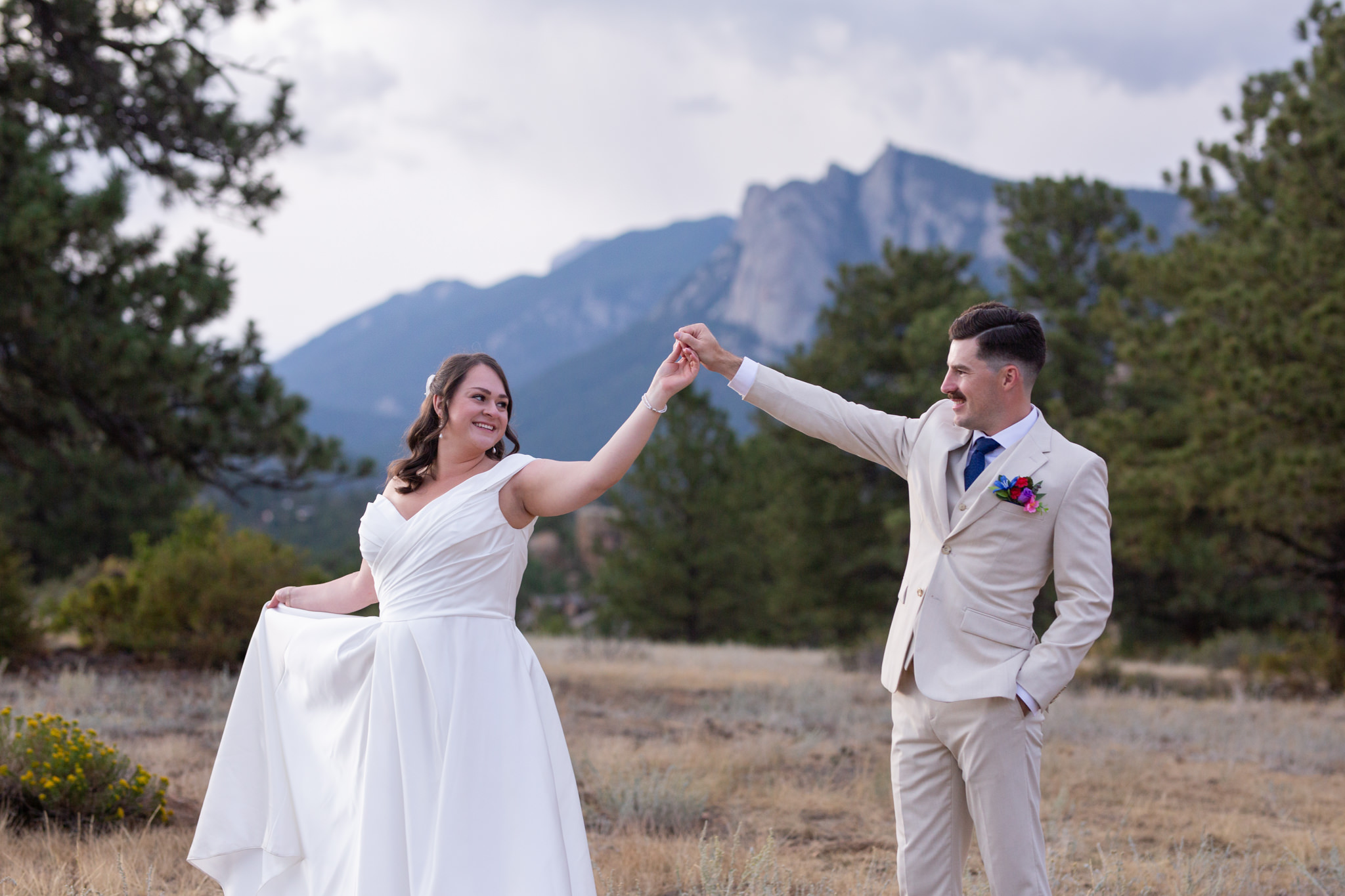 A couple dances during their Estes Park Elopement at Knoll Willow Open Space