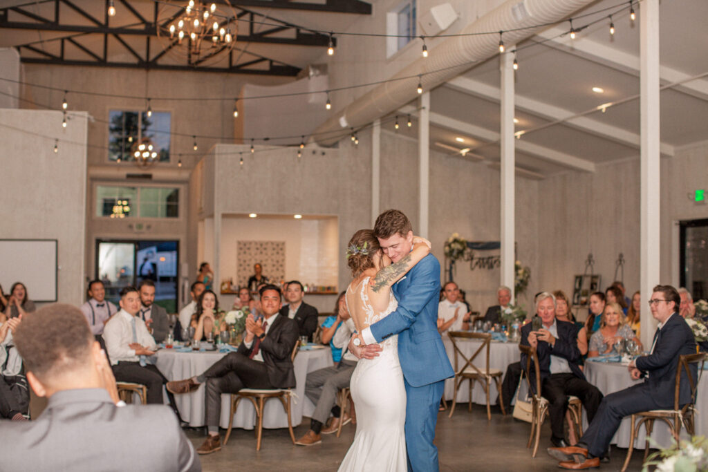The bride and groom enjoy their first dance as a married couple at The Woodlands wedding venue.