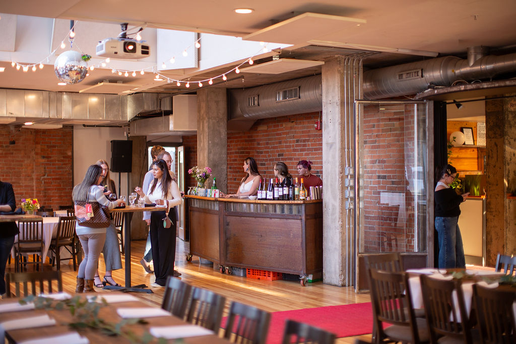 A look at an active reception with bar set up at the riverside wedding venue