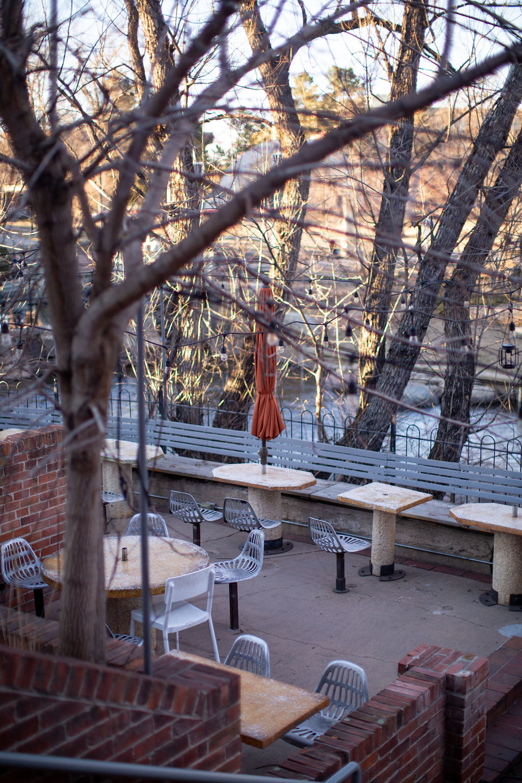 A look down into the back patio overlooking the river at the riverside wedding venue