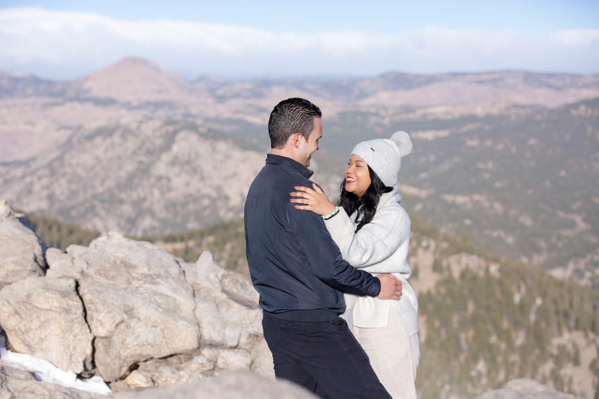A couple embrace after getting engaged near Trail ridge road