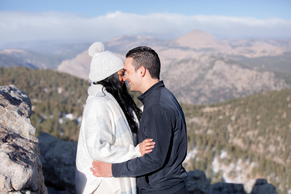 Engaged with a view of Longs Peak, one of the Best Rocky Mountain National Park Proposal Locations.