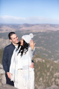 A newly engaged woman shows of her ring after her boyfriend proposed during a trip to Colorado