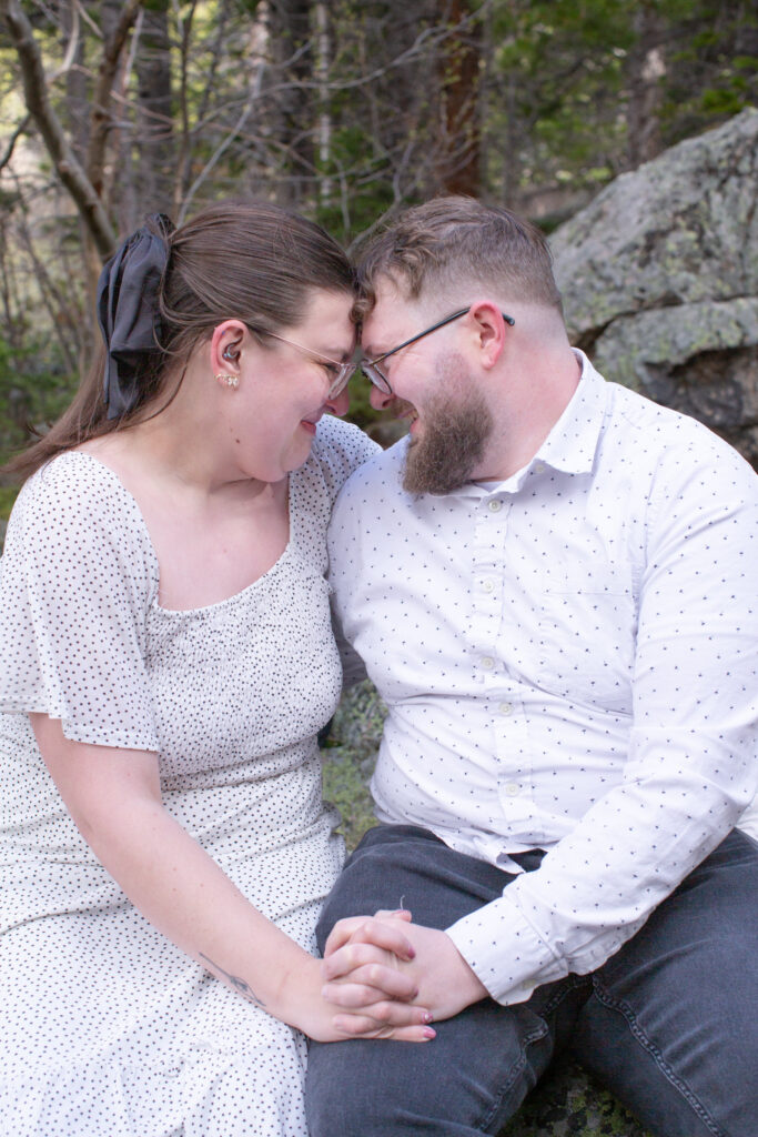 A couple share an intimate moment together during their engagement session, byt Rocky Mountain National Park Engagement Photographer Stephanie Eddy