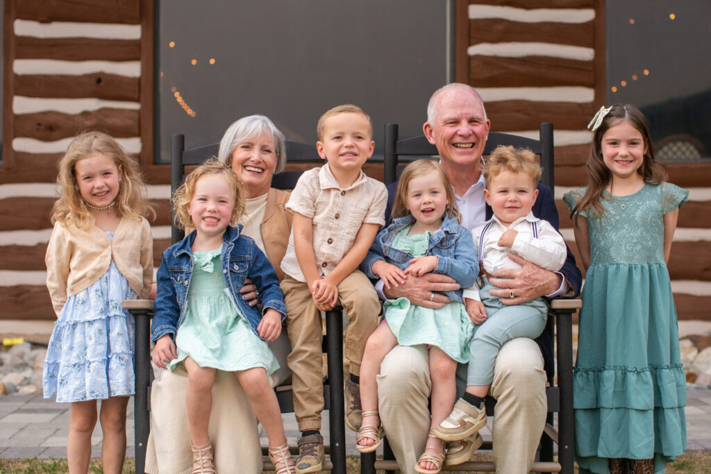 Couple celebrating their 45th anniversary at Keystone Ranch wedding venue in Colorado with their grandchildren