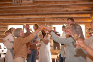 Family and friends toasting a couple’s 45th anniversary at Keystone Ranch wedding venue in Colorado