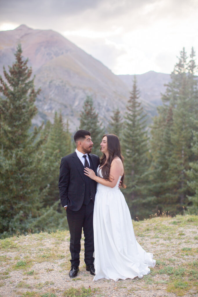 Couple looking into each other’s eyes during their intimate Breckenridge mountain elopement
